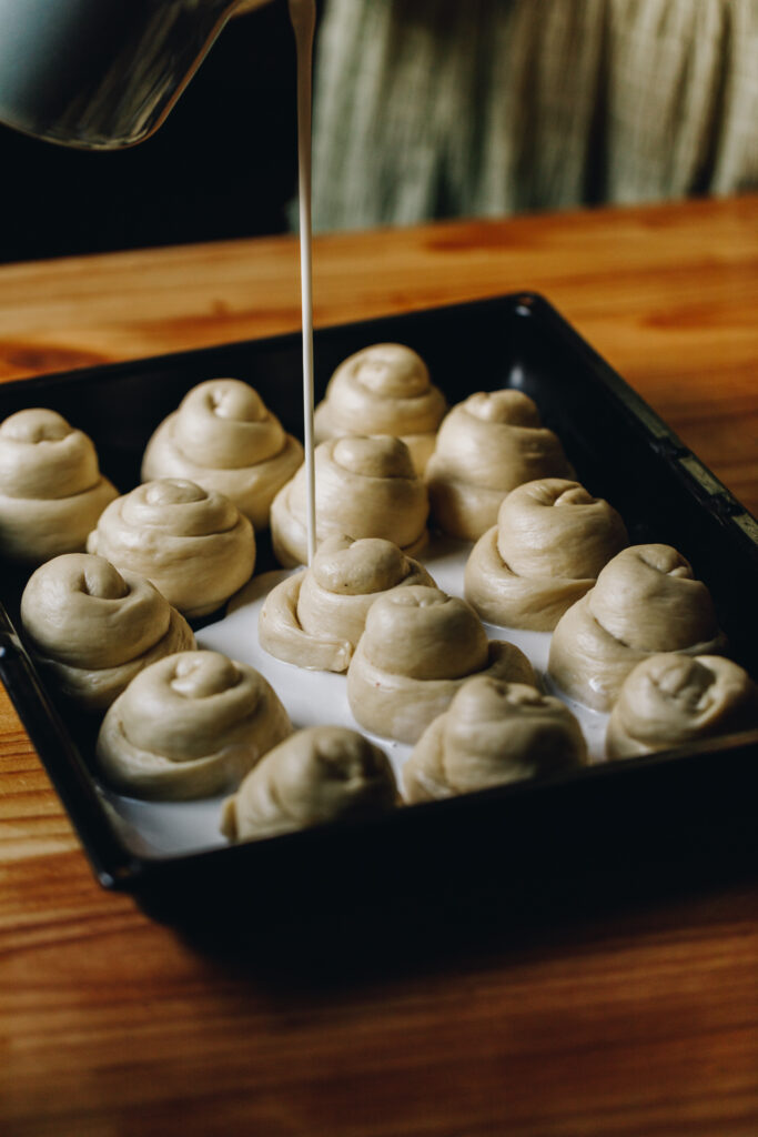 Pour the coconut sauce over the buns