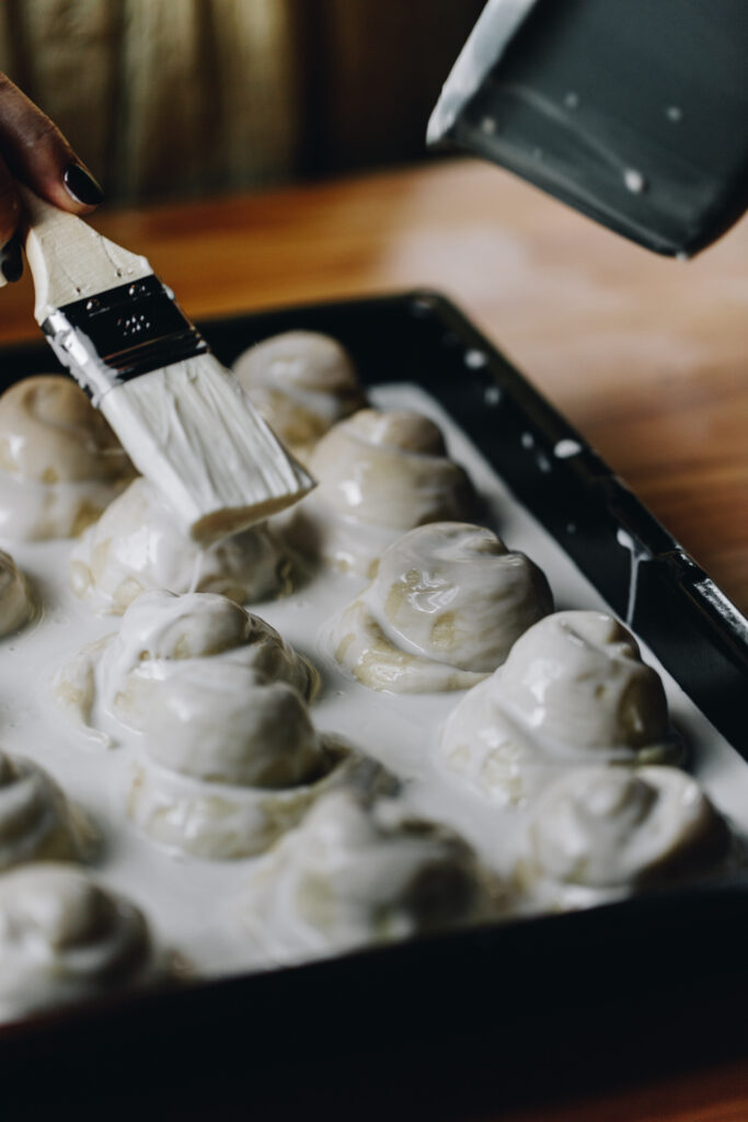 Baste the coconut buns with the sauce