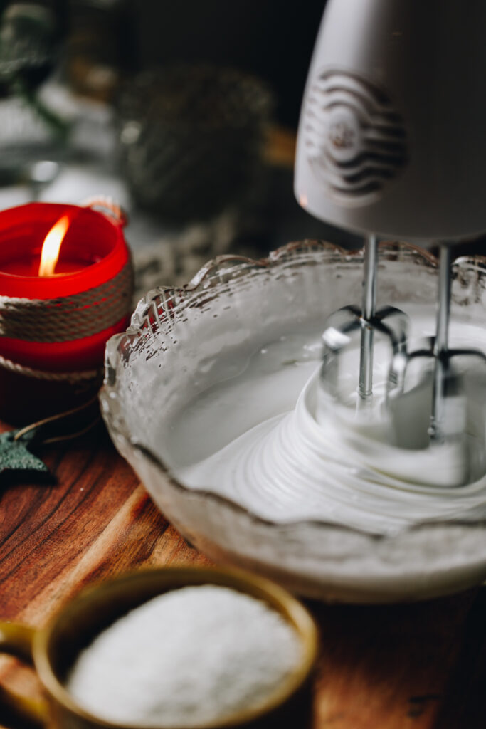 Whisk the warm egg whites