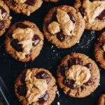 Top shot of freshly baked with wheat free breakfast cookies with melty chocolate and peanut butter on top.