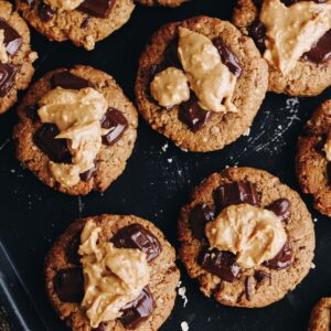 Top shot of freshly baked with wheat free breakfast cookies with melty chocolate and peanut butter on top.