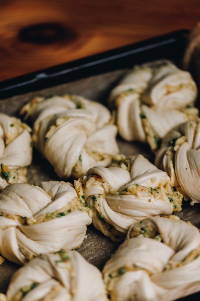 The dough filled with garlic, herbs and cheese