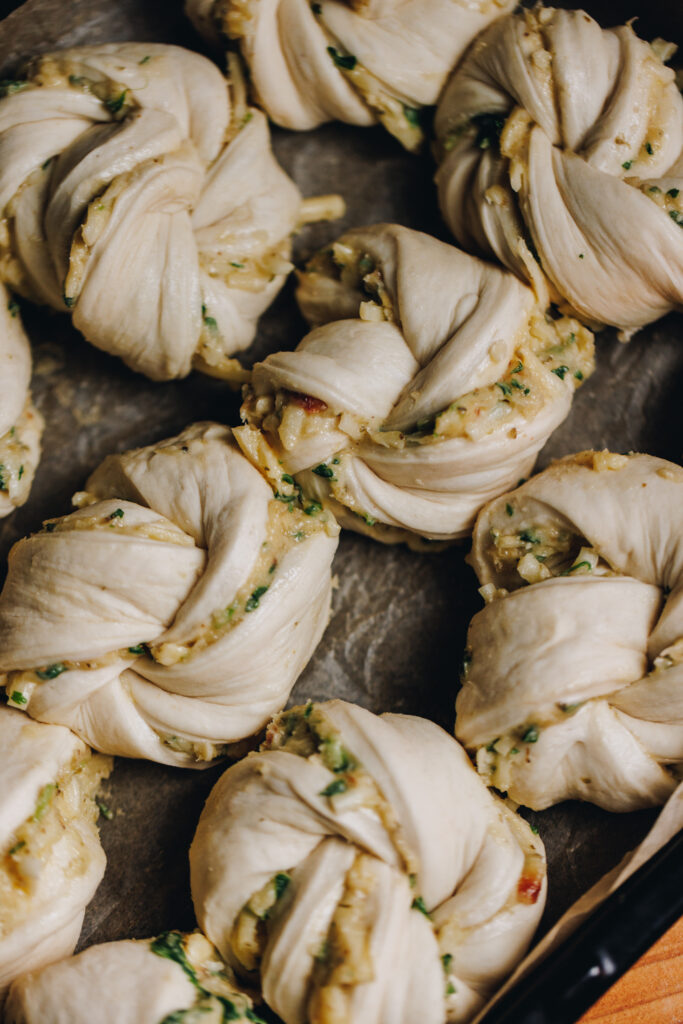 The dough filled with garlic, herbs and cheese