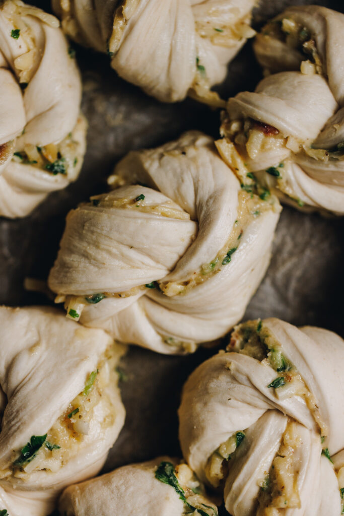 The dough filled with garlic, herbs and cheese