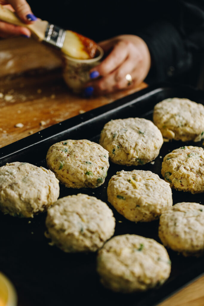 brie stuffed scones on a tray