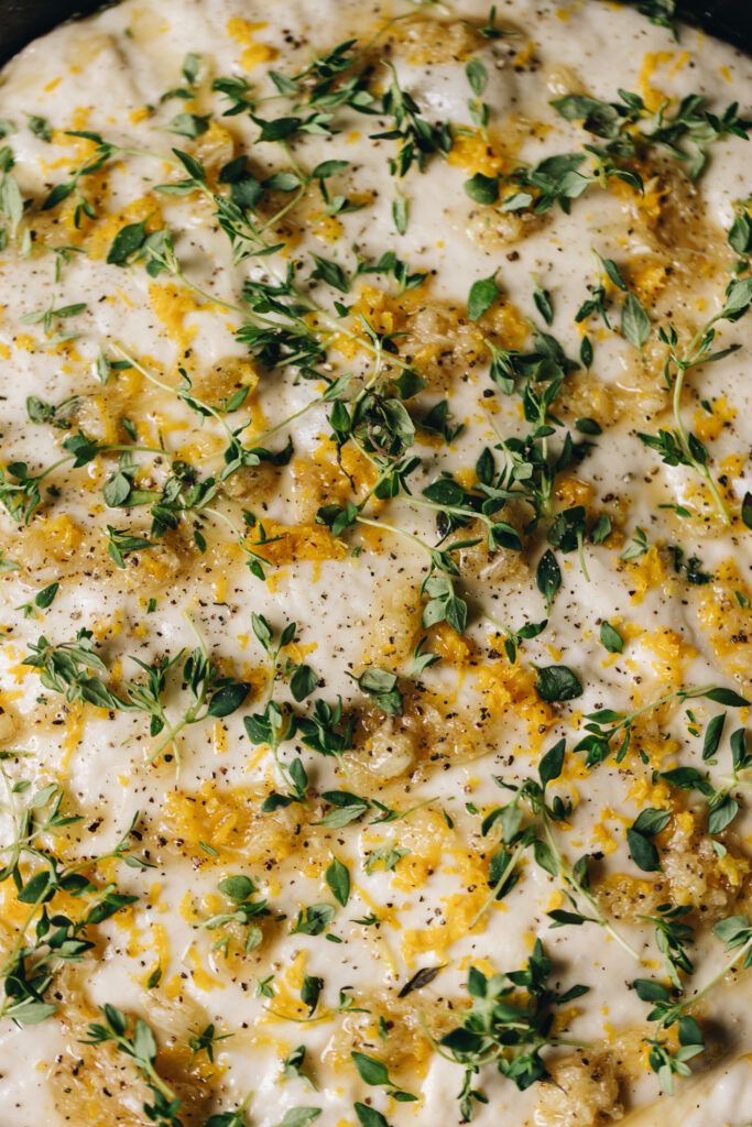 Add thyme, lemon and garlic to the dough