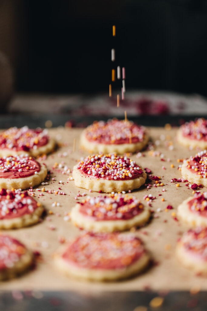 Pink white chocolate icing with sprinkles