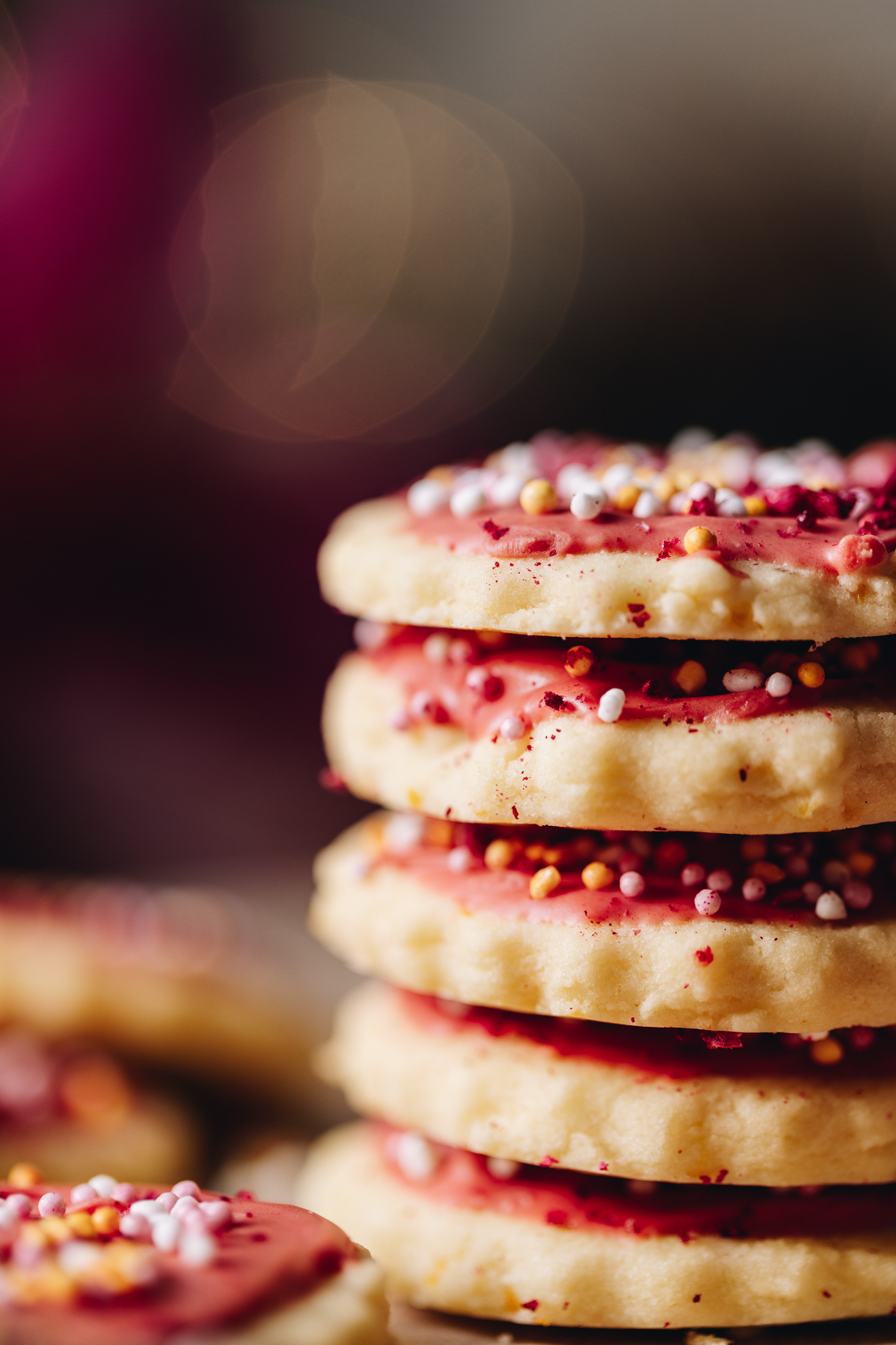 A close up pile of hundreds and thousands biscuits baked and decorated.