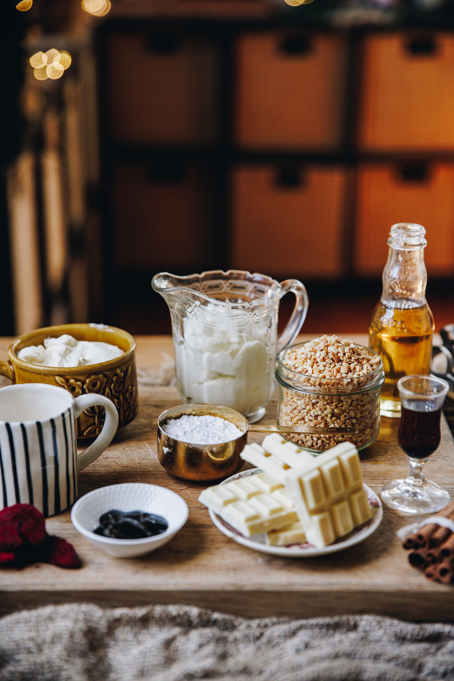 ingredients are in different vintage bowls and are sitting on a wooden board on top of wooden table. 
