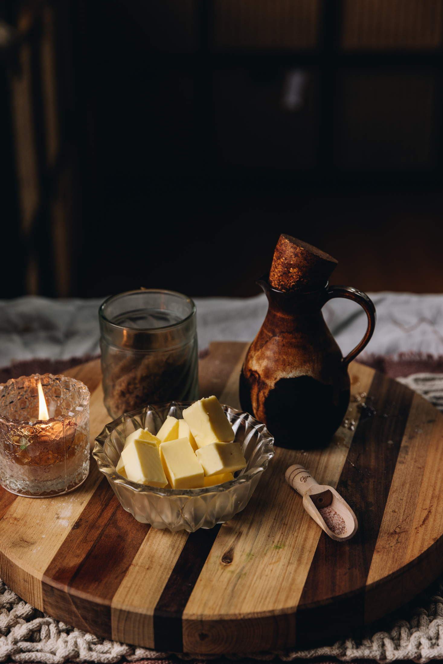 Ingredients sit of a wooden board that is round. 
