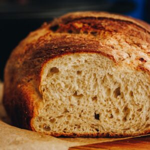 Close shot of Cottage Cheese Cumin Loaf has been cut open to reveal the soft interior.