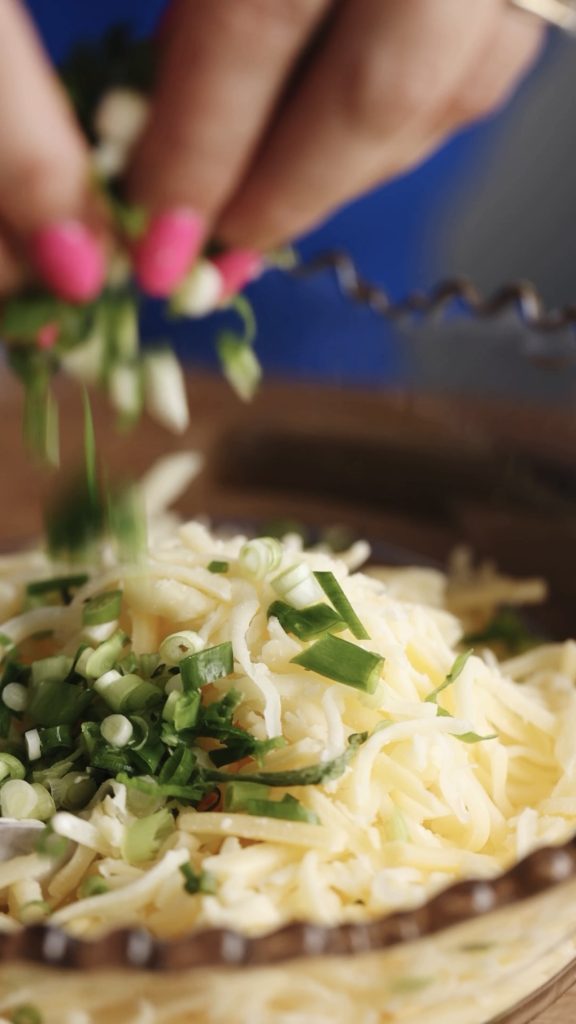 cheese and sliced spring onions