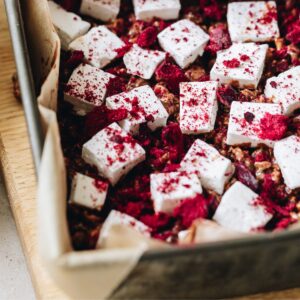 Close up of sliced easy homemade vanilla marshmallow with free-dried raspberries on top.