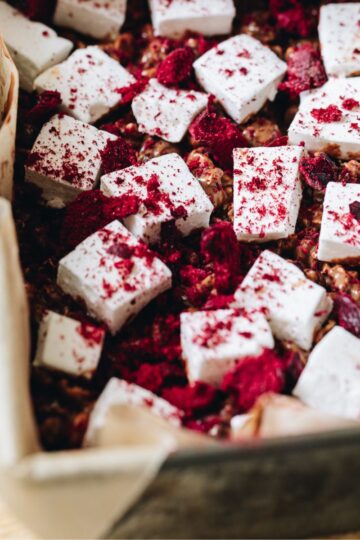 Close up of sliced easy homemade vanilla marshmallow with free-dried raspberries on top.