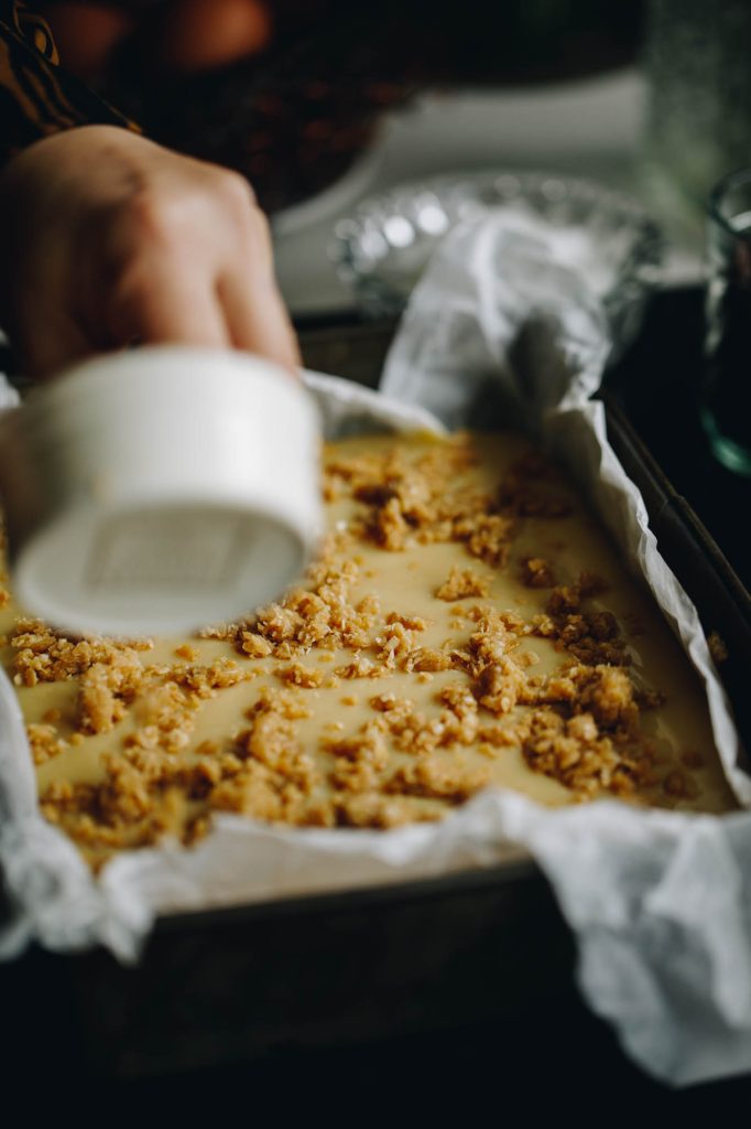 Sprinkle some of the base on the caramel