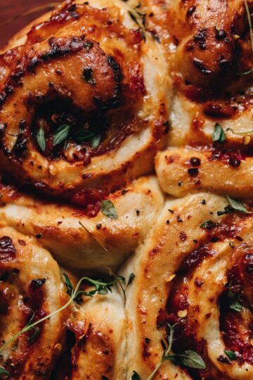 Close up of Cheese and Tomato Scrolls that are freshly baked.