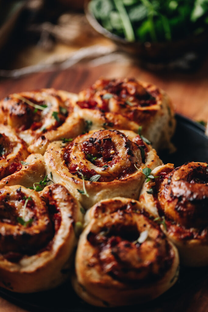 Close up of Cheese and Tomato Scrolls that are freshly baked.