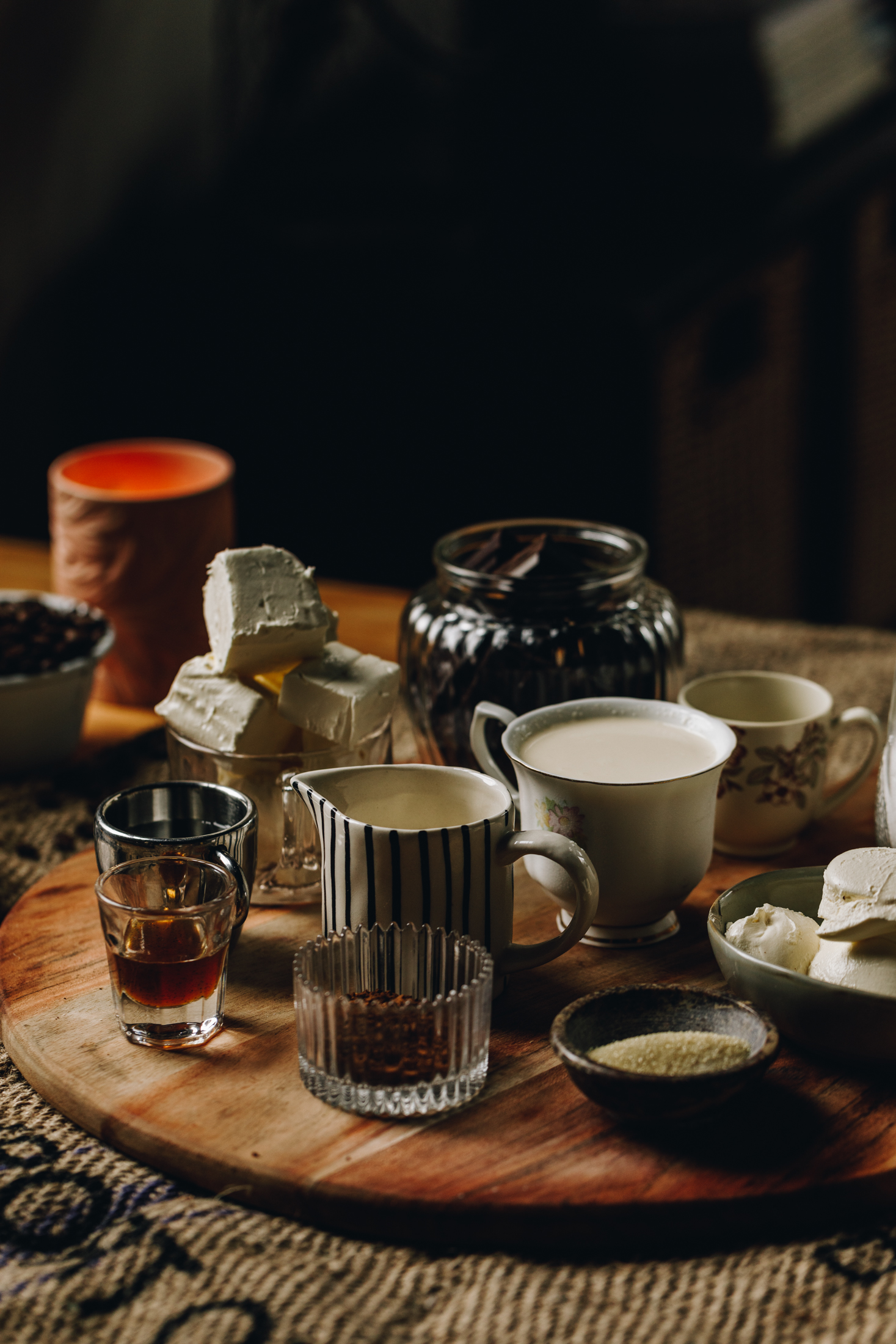 Swiss Meringue ingredients are in different vintage bowls and are sitting on a wooden board.