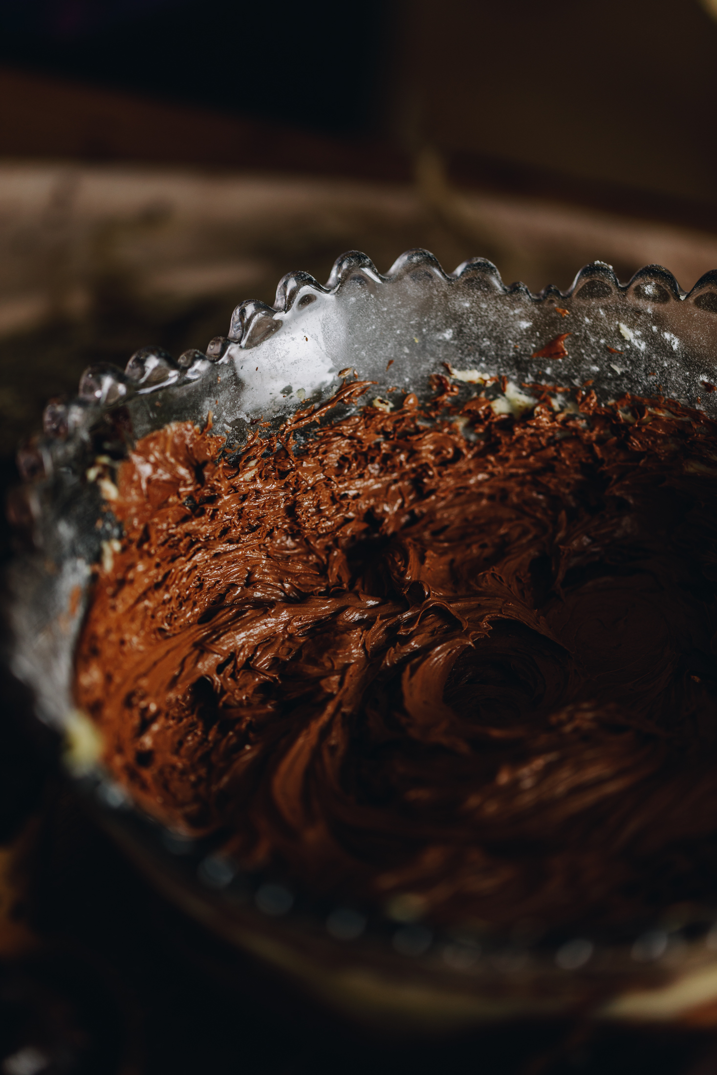 Whipped chocolate buttercream in a purple vintage bowl. 